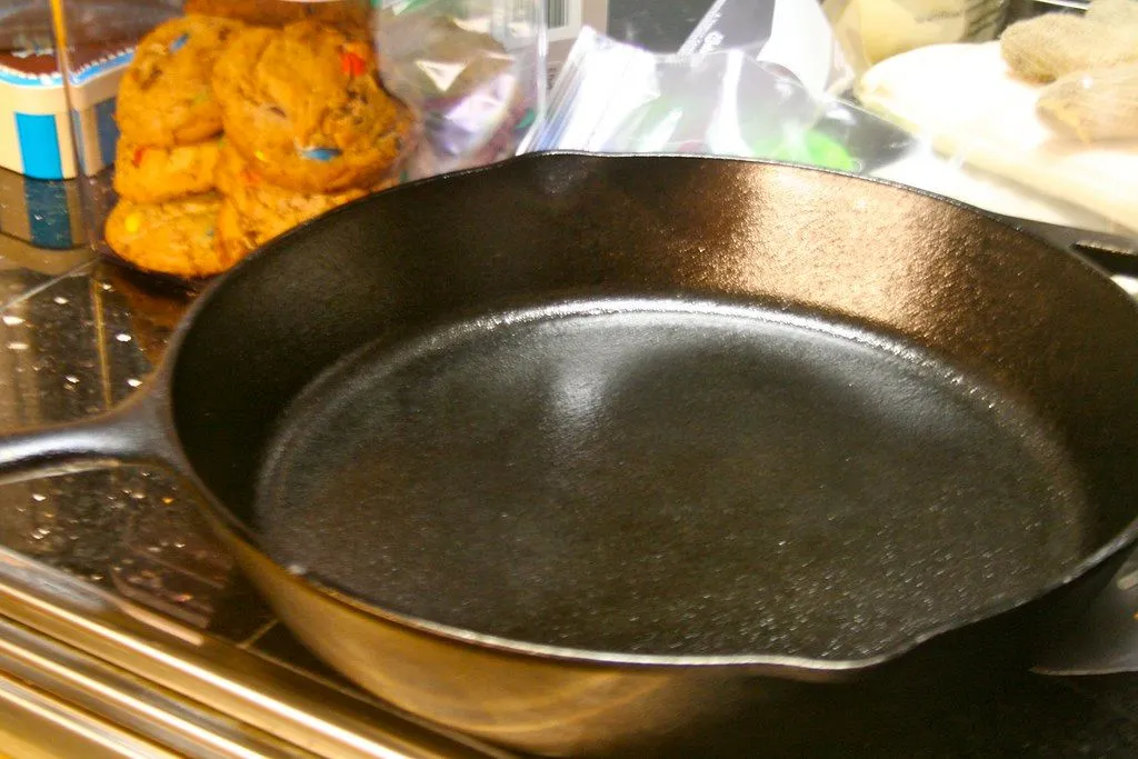 A seasoned cast iron skillet with a dark, slightly rough surface