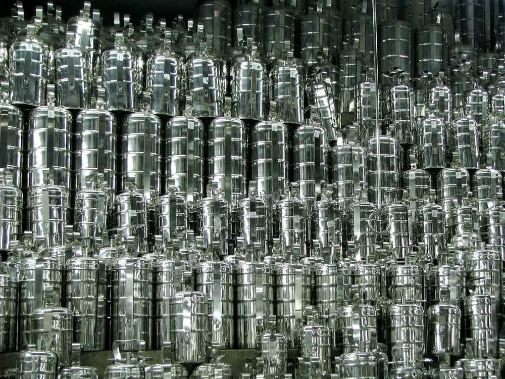 Stacked shiny stainless steel tiffin carriers in a shop in Chennai, India