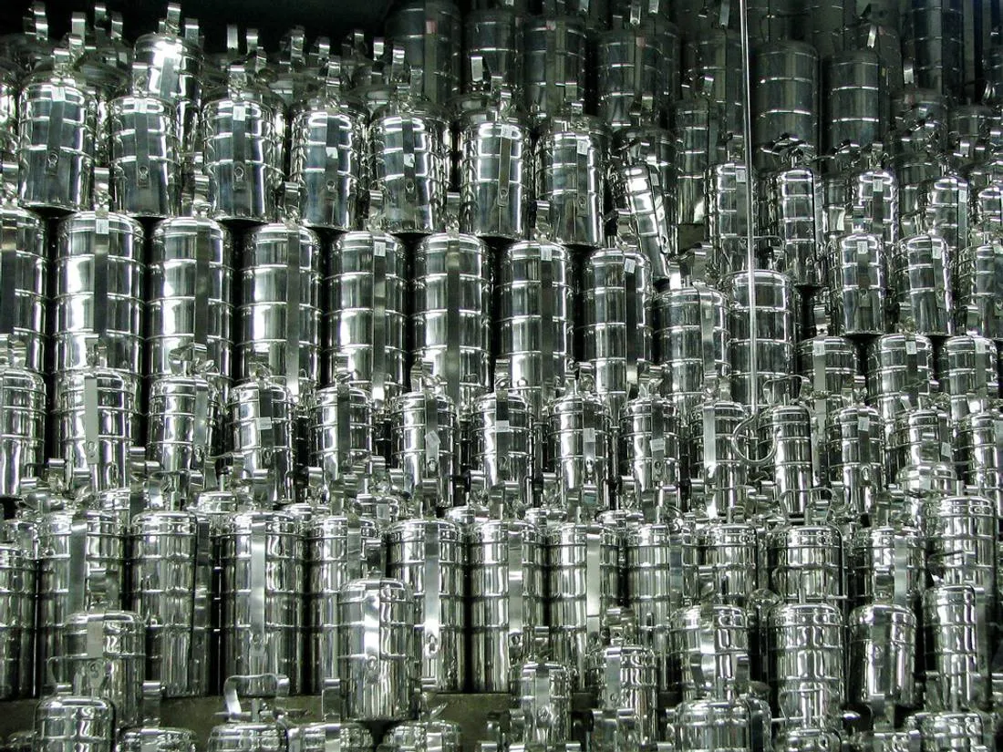 Rows of shiny stainless steel tiffin boxes stacked in a shop in Chennai